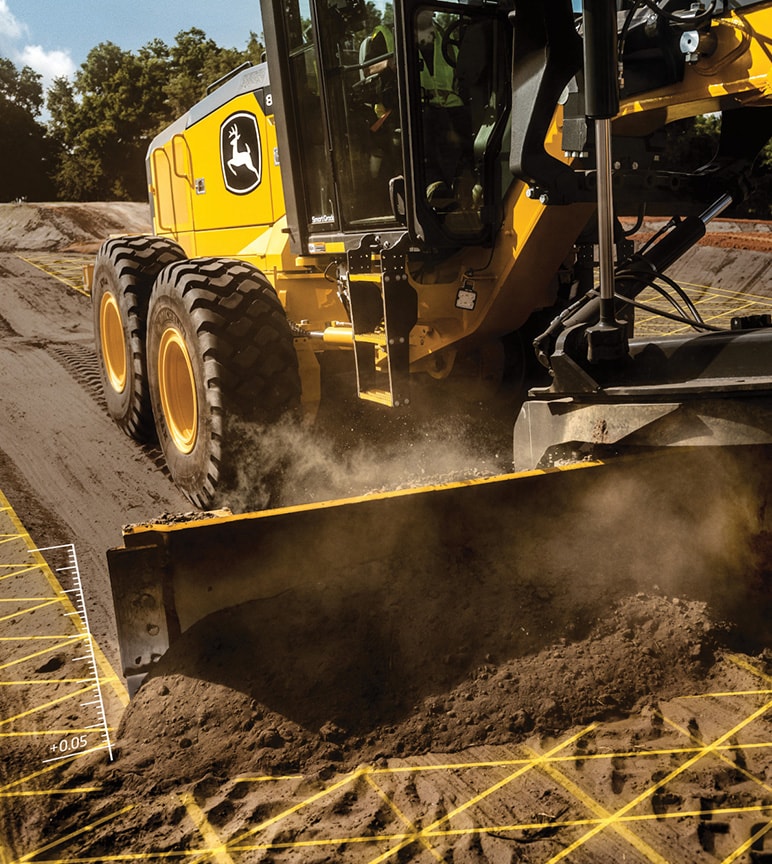 Deere construction equipment leveling dirt