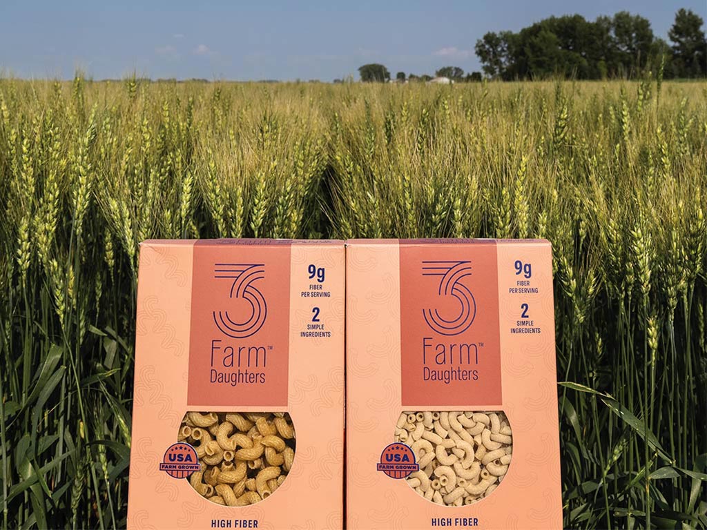 Pasta package in front of wheat field